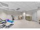 Finished basement with a large open area for recreation, art, or gym equipment on a clean carpeted floor at 12504 Bayleaf Church Rd, Raleigh, NC 27614