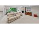 Finished basement with a fireplace, cozy seating, large windows with green space views and neutral carpet at 12504 Bayleaf Church Rd, Raleigh, NC 27614