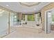 Elegant bathroom with a glass-enclosed shower, garden tub, large window, and tile flooring at 12504 Bayleaf Church Rd, Raleigh, NC 27614