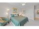 Relaxing bedroom featuring a ceiling fan, neutral walls, and plush carpet at 12504 Bayleaf Church Rd, Raleigh, NC 27614