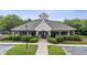 Community clubhouse featuring stone accents, covered entrances, landscaping and convenient parking at 12504 Bayleaf Church Rd, Raleigh, NC 27614