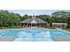 Beautiful community pool area with lounge chairs and well-manicured landscaping, perfect for relaxing at 12504 Bayleaf Church Rd, Raleigh, NC 27614