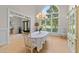 Bright dining area with large windows and classic decor perfect for entertaining and special occasions at 12504 Bayleaf Church Rd, Raleigh, NC 27614