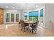 Bright breakfast nook with a round table, and windows with green views at 12504 Bayleaf Church Rd, Raleigh, NC 27614