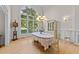 Classic dining area with large arched windows that bring in natural light to illuminate gatherings at 12504 Bayleaf Church Rd, Raleigh, NC 27614