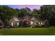 Beautiful brick home with mature landscaping and a welcoming entrance for curb appeal at 12504 Bayleaf Church Rd, Raleigh, NC 27614