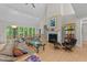 Spacious living room featuring a fireplace, hardwood floors, and plenty of natural light at 12504 Bayleaf Church Rd, Raleigh, NC 27614