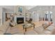 Cozy living room with a fireplace, hardwood floors, and elegant furnishings at 12504 Bayleaf Church Rd, Raleigh, NC 27614