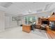 Well-lit office area featuring desk, shelves, office chair, and a large window at 12504 Bayleaf Church Rd, Raleigh, NC 27614