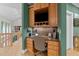 Home office with built-in shelves, granite countertops, and ample storage space at 12504 Bayleaf Church Rd, Raleigh, NC 27614