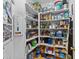 Walk-in pantry with ample shelving to store all of your kitchen supplies at 12504 Bayleaf Church Rd, Raleigh, NC 27614