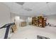 Large storage room with carpet, shelving and access to a door at 12504 Bayleaf Church Rd, Raleigh, NC 27614