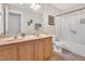 Bathroom with double sinks, a framed mirror, and bathtub, blending functionality with style at 1309 Caribou Xing, Durham, NC 27713