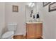 Cozy powder room featuring a vanity with cabinet storage, framed mirror, and neutral wall color at 1309 Caribou Xing, Durham, NC 27713