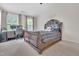 Stylish bedroom with a plush bed, elegant decor, and a cozy workspace for relaxation and productivity at 1309 Caribou Xing, Durham, NC 27713