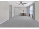 Spacious bedroom features carpet flooring, a ceiling fan, and built-in media cabinet at 1309 Caribou Xing, Durham, NC 27713