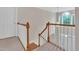 Open foyer features a large window, hardwood stairs, and a modern light fixture at 1309 Caribou Xing, Durham, NC 27713