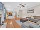 Bright living room with hardwood floors, ceiling fan, comfortable seating, and view into kitchen at 1309 Caribou Xing, Durham, NC 27713