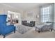 Comfortable living room featuring a sofa, accent chairs, carpet, and neutral paint at 1309 Caribou Xing, Durham, NC 27713