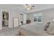 Bright bedroom with a ceiling fan, carpet, and closet, creating a serene and comfortable living space at 1311 Theodore Ln, Durham, NC 27703