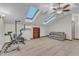 Large bonus room featuring skylights, a ceiling fan, and plenty of open space for activities and relaxation at 1311 Theodore Ln, Durham, NC 27703