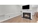 Cozy living room featuring a fireplace, hardwood floors, and neutral paint, perfect for relaxing and entertaining at 1311 Theodore Ln, Durham, NC 27703