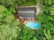 An aerial view of the backyard that features a pool and deck at 14 Gloucester Ct, Durham, NC 27713