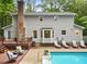 The backyard features a pool, deck, and beautiful landscaping at 14 Gloucester Ct, Durham, NC 27713