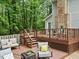 Spacious wooden deck featuring outdoor furniture and beautiful backyard at 14 Gloucester Ct, Durham, NC 27713