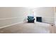 Cozy living room features neutral walls, carpeted floors, and stylish accent pieces at 14 Gloucester Ct, Durham, NC 27713