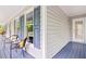Cozy chairs on the porch offering an inviting space to enjoy scenic views and unwind at 14 Gloucester Ct, Durham, NC 27713