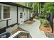 Charming backyard featuring a wooden walkway and well-maintained landscaping with trees at 1420 Seabrook Ave, Cary, NC 27511