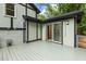 Backyard deck leading to a sliding glass door and views of the surrounding landscape at 1420 Seabrook Ave, Cary, NC 27511