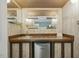This home has a bar area with a wood countertop, decorative tile, and a mini-fridge at 1420 Seabrook Ave, Cary, NC 27511