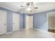 Light blue bedroom featuring a ceiling fan, two closets and trim details at 1420 Seabrook Ave, Cary, NC 27511