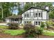 Charming two-story home with a beautifully landscaped front yard, featuring Tudor-style architecture at 1420 Seabrook Ave, Cary, NC 27511