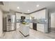 Charming kitchen boasts stainless steel appliances, a kitchen island, and sleek black countertops at 1420 Seabrook Ave, Cary, NC 27511