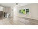 Bright living room with hardwood floors, large windows, and elegant staircase for a welcoming atmosphere at 1420 Seabrook Ave, Cary, NC 27511