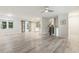 Expansive living area features hardwood flooring, a ceiling fan, and ample natural light at 1420 Seabrook Ave, Cary, NC 27511