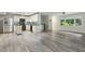Bright open concept living area with hardwood floors, a kitchen with stainless appliances, and natural light at 1420 Seabrook Ave, Cary, NC 27511
