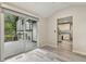 Sun room with hardwood floors, a door to the kitchen, and a sliding glass door to the deck at 1420 Seabrook Ave, Cary, NC 27511