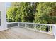 A view of the property's back deck shows the trees and natural beauty surrounding the home at 1603 Timber Wolf Dr, Durham, NC 27713