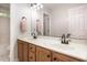 Bathroom featuring a double sink vanity, providing plenty of counter space with soft lighting and a tiled floor at 1603 Timber Wolf Dr, Durham, NC 27713