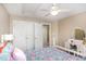 Bedroom with a ceiling fan, closet with double doors, and white vanity offering functionality and charm at 1603 Timber Wolf Dr, Durham, NC 27713