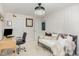 Office/Bedroom space featuring a contemporary ceiling light, daybed, and a desk area perfect for work or relaxation at 1603 Timber Wolf Dr, Durham, NC 27713