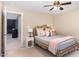 Bedroom with ceiling fan, decorative bed frame, and gray and pink pillows, offering a serene space at 1603 Timber Wolf Dr, Durham, NC 27713