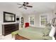 Comfortable main bedroom with a vaulted ceiling, wooden furniture, and a bright sitting area for relaxation at 1603 Timber Wolf Dr, Durham, NC 27713