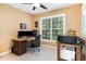 Functional home office featuring a spacious desk, dual monitors, and bright natural light for a productive workspace at 1603 Timber Wolf Dr, Durham, NC 27713