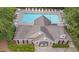 An aerial view of the property's outdoor pool features lounge chairs and tables at 1603 Timber Wolf Dr, Durham, NC 27713