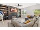 Inviting living room featuring a fireplace, built-in shelving, and cozy sectional sofa at 18 Dot Dr, Wendell, NC 27591